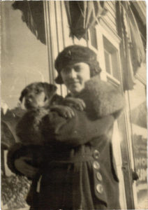 Susan Bailey with family pet outside the house. 